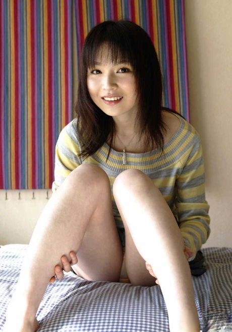 Young Japanese girl Kanan Kawaii flashes upskirt panties before getting naked 76105029