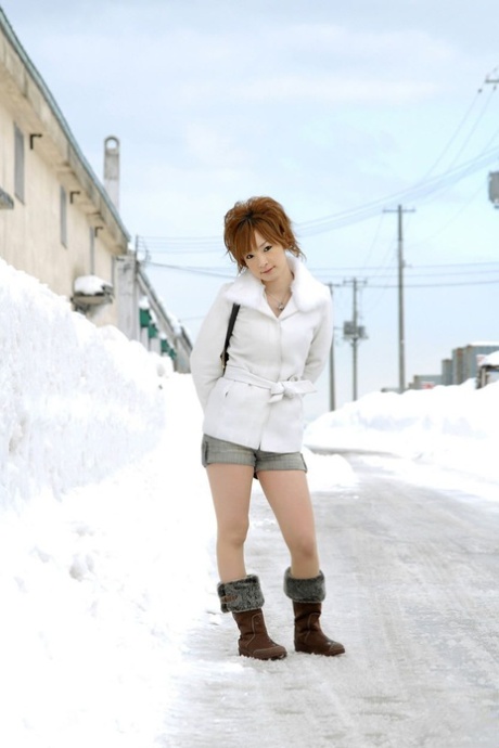 Cute redheaded Japanese teen Rinko gets naked to bathe on a winters day