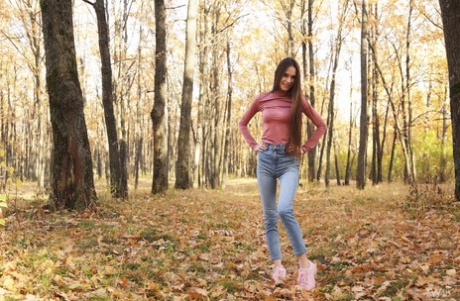 Nice Russian girl Leona Mia eats an ice cream treat in a forest while clothed 41998463