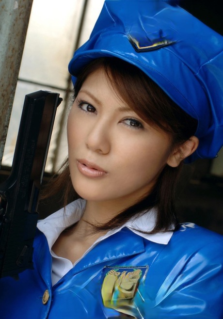 Asian policewoman Anna wields a pistol in a short latex skirt and pantyhose 58244810