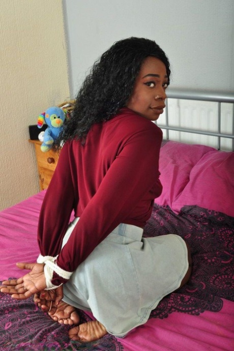 Black girl finds herself tied up on a bed while fully clothed and barefoot 86002061
