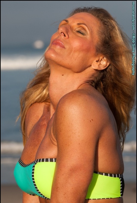 Female bodybuilder Kimberly Dickson poses in a bikini while at the beach 41874943