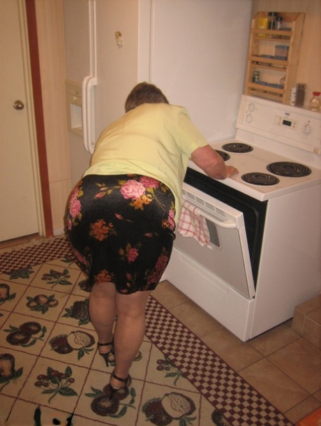 Old woman Girdle Goddess strips to pantyhose in her kitchen 76707932
