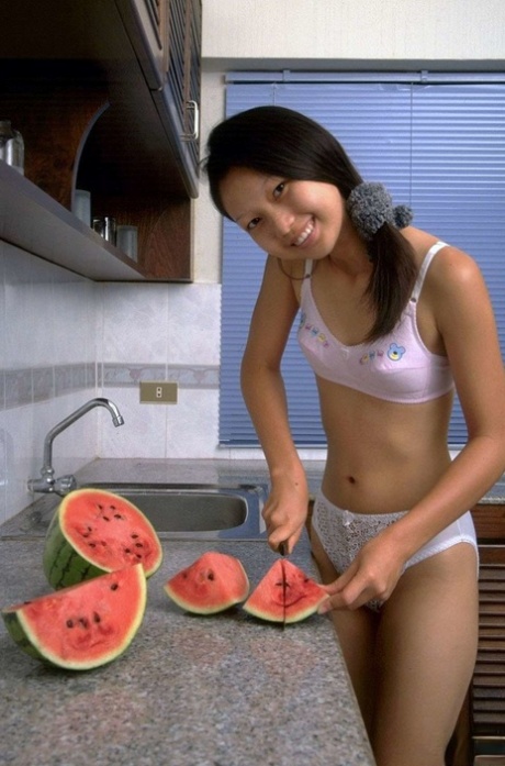 Petite Asian girl spreads her tight pussy after eating watermelon 17257460