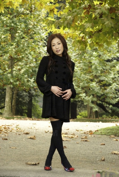 Fully clothed Japanese teen models in the park in black clothes and stockings 69438495