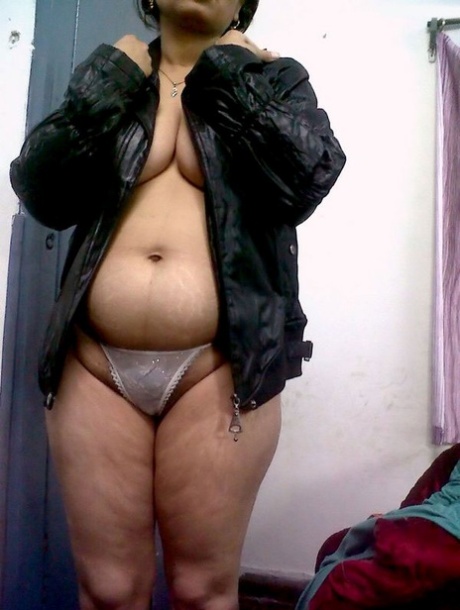 Fat Indian woman hides her face while adorned in a bra and thong 17352431
