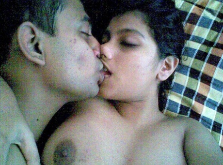 Busty Indian woman joins her man friend for foreplay on bed