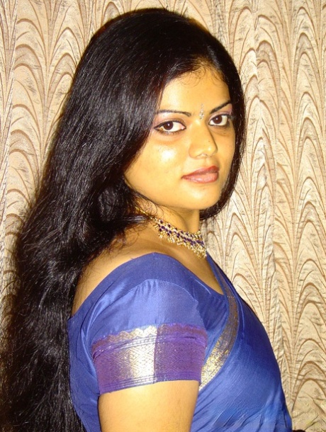Pretty Indian girl sets her natural tits free of traditional clothing