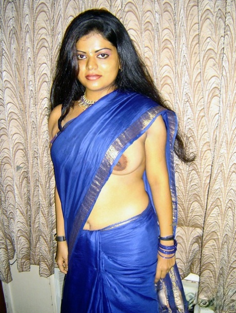 Pretty Indian girl sets her natural tits free of traditional clothing 18740371