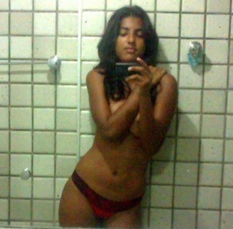 Indian girl takes selfies in a bathroom after unveiling her nice tits 47950573