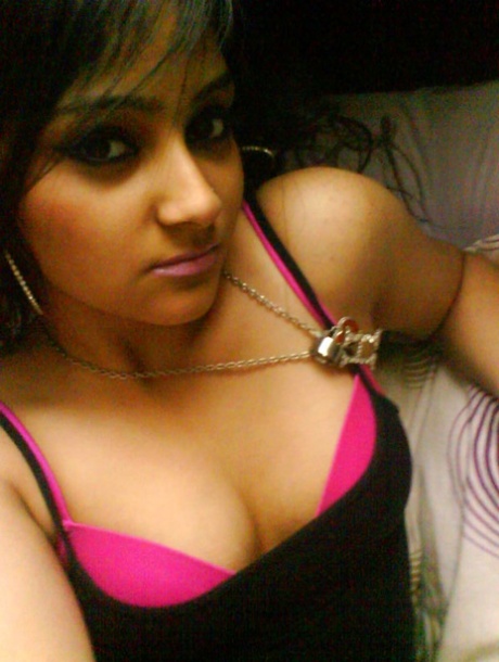 Pretty Indian girl exposes a bare shoulder during self shot action 70291218