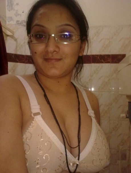 Overweight Indian student shows her bare mid-section in a brassiere 73378501