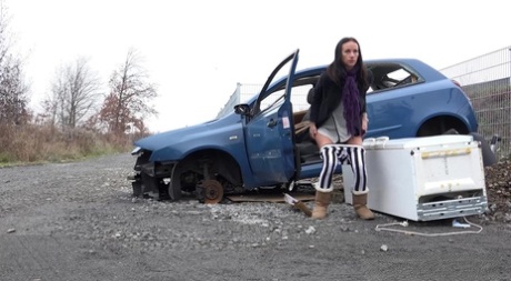 Eveline squats behind an abandoned car to pee 98072886