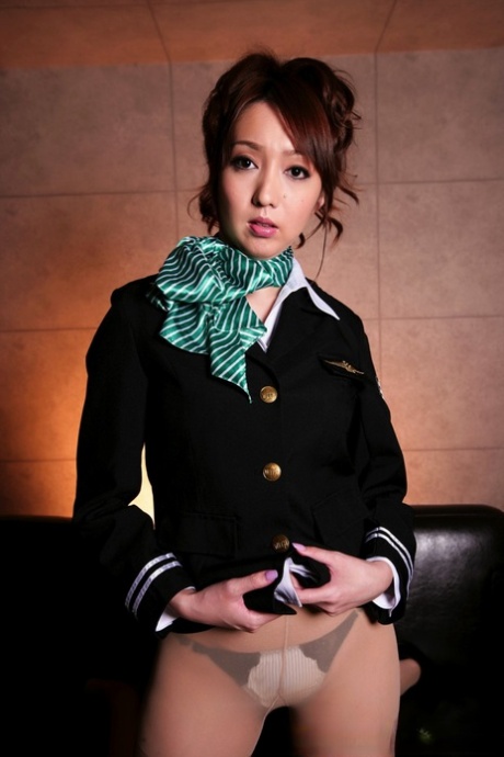 Beautiful Japanese girl looses her breasts from her pilot's uniform 22861083