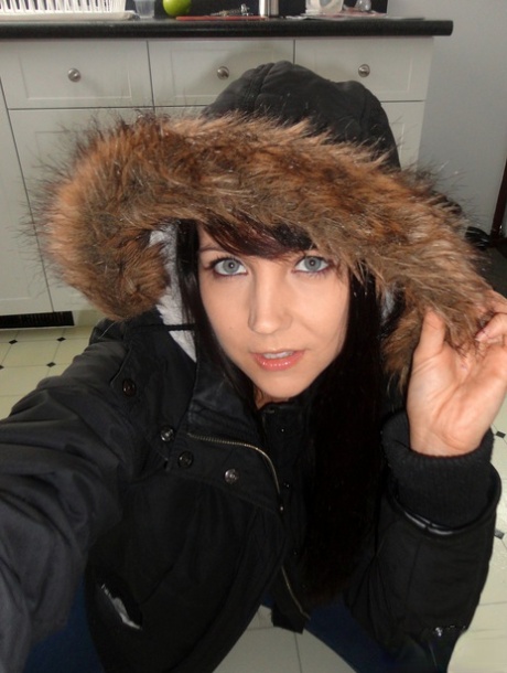 Teen amateur Andi Land takes self shots on her kitchen floor in a winter coat 78657455