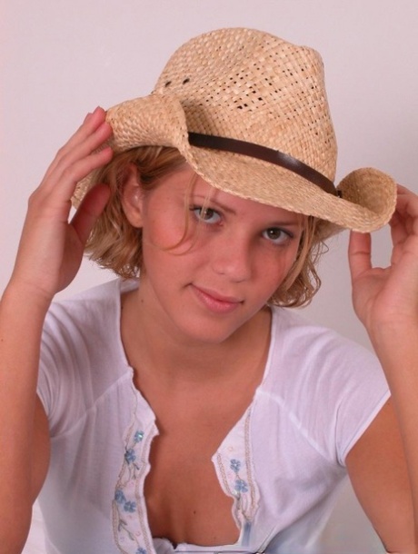 Young blonde Karen covers up her naked breasts with a straw hat in SFW action 40024783