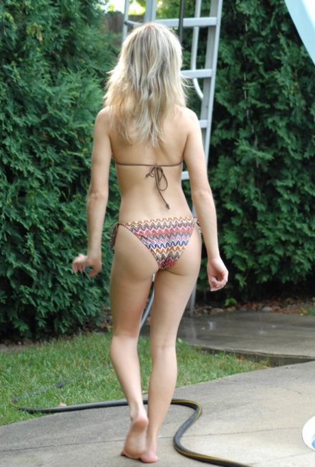 Blonde teen Kasia doffs bikini before water sliding in the nude 72584231