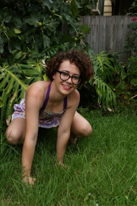 Geeky girl Rosie wears her glasses for her nude debut on the back lawn
