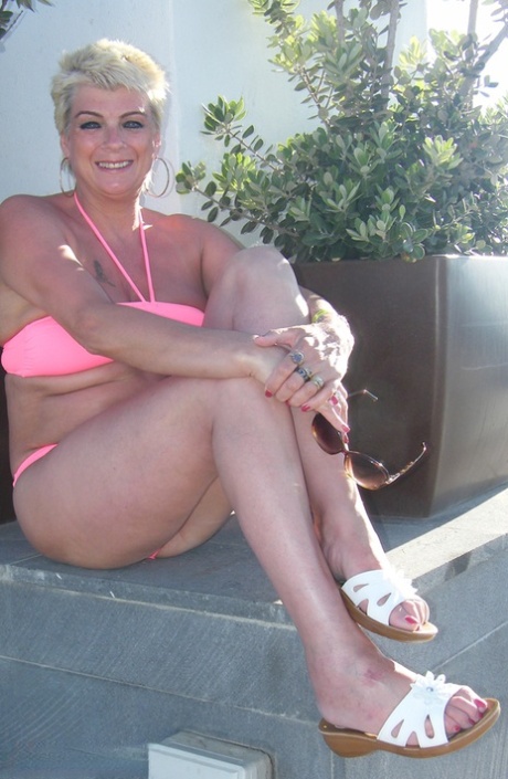 Mature lady with short blond hair Dimonty stands naked before going for a swim 35973794