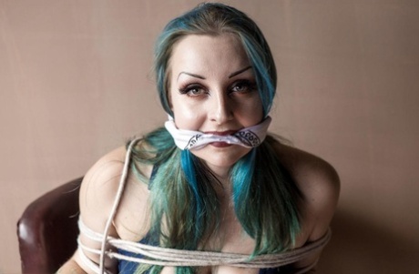 Caucasian chick with dyed hair is tied to a chair while cleave gagged 47873325