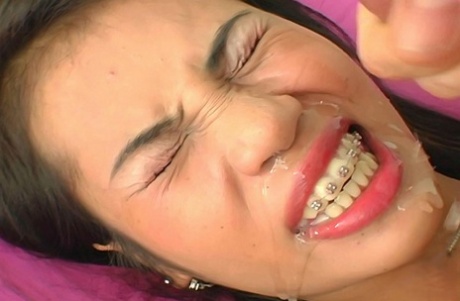 Asian girl Nue takes a cumshot on her braces during a closeup 76754688