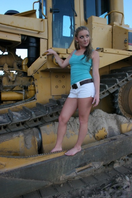 Teen first timer Abbie gets totally naked on tracks of heavy equipment 62976966