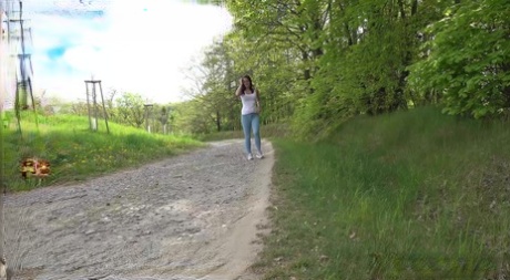 Pretty girl Amanda Hill pulls down her tight pants to piss on a gravel path 32282006