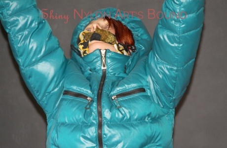 Redheaded chick is restrained and gagged while wearing a winter coat 30972209