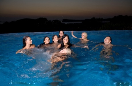 A group of hot chicks go for a skinny dip as the sun fades in the sky 20784505