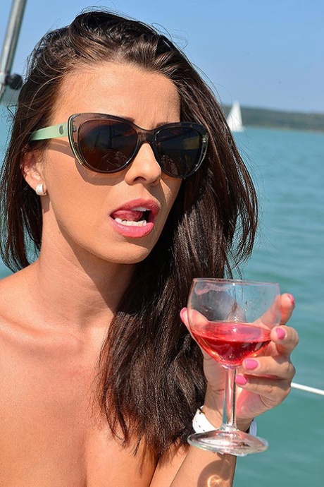 Sexy brunette Vicky Love gets naked over drinks on a boat in designer shades 87891299