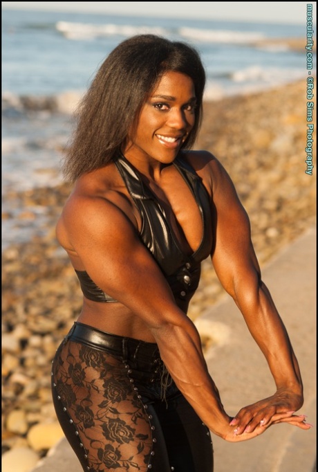 Ebony bodybuilder Jaquita Person Taylor flexes while walking her dogs 86553102