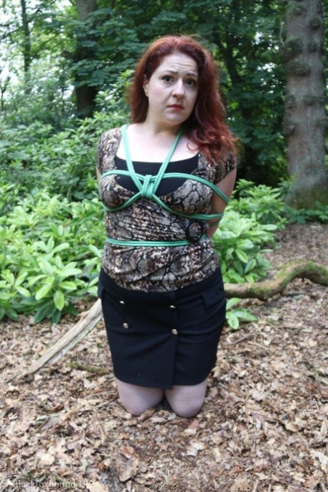 Natural redhead is left alone in the woods while gagged and hogtied 19792694