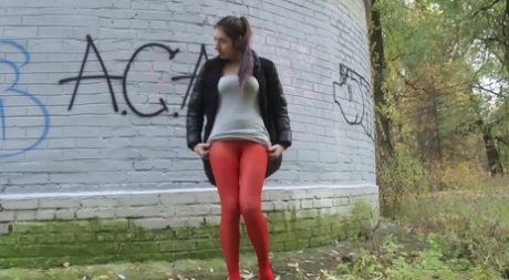 White girl Diana Sweet pulls down red pantyhose to pee behind a building 20136179