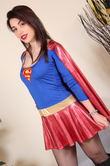 Gorgeous girl Petra shows her hose attired feet in a Superman costume 15717636