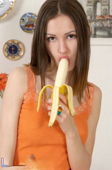 Skinny teen Lovely Irene strips to her socks while eating a banana 31835028