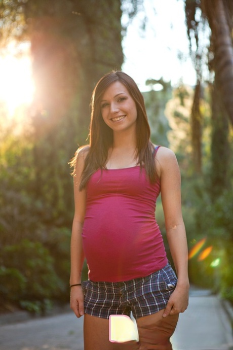 Pregnant girl strips down to her birthday suit on a stone walkway 74893856