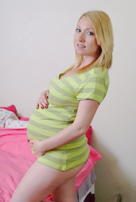 Heavily pregnant blonde spreads her legs after getting naked on a bed 36202417