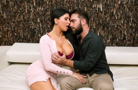 Busty brunette Romi Rain has sex with her man friend on a sofa 25791788