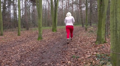 Blonde Lilith relieves pee desperation in woods 89318485