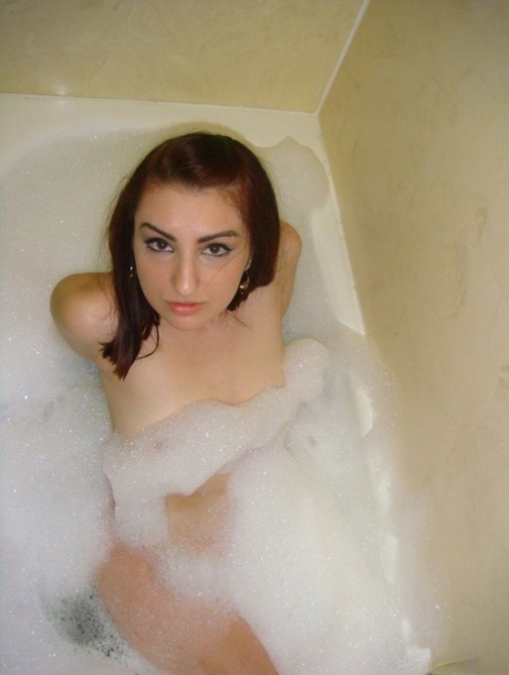 Redheaded amateur Evie takes a bubble bath before a nude tease shoot 86397758