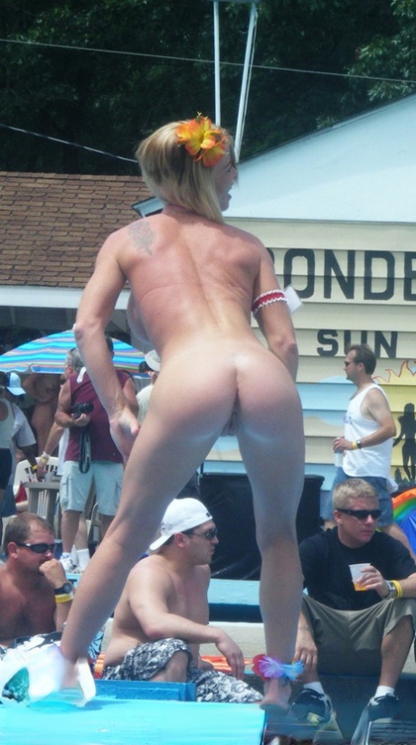 Naked strippers decorate the stage during an outdoor festival 38403422