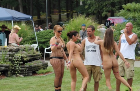 Caucasian strippers pose in the nude while attending an adult festival 51172551