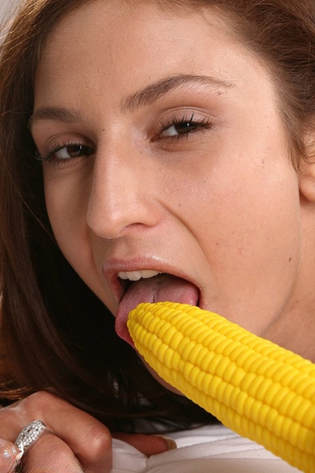 Adorable teen rams a corn cob vibrator up her asshole during closeups