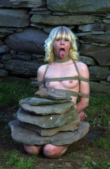Blonde chick Sarah Jane Ceylon is restrained in a variety of ways in a dungeon 62702277