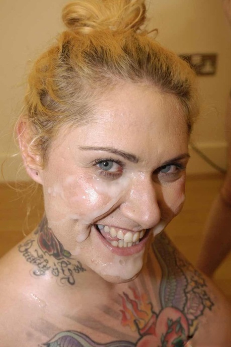 Tattoo freak Tallulah Tease wears a smile and cum on her face after a blowbang 19322253