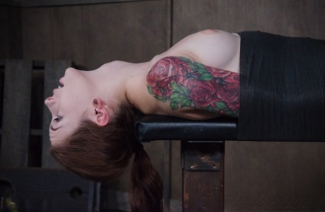 Tattooed female Anna De Ville endures a throat fuck on a bondage table 39861210