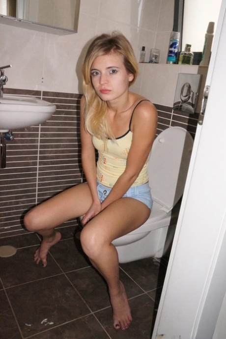Young cutie Zoey Ryder bares her tiny tits and blows bubbles on the toilet 69913386