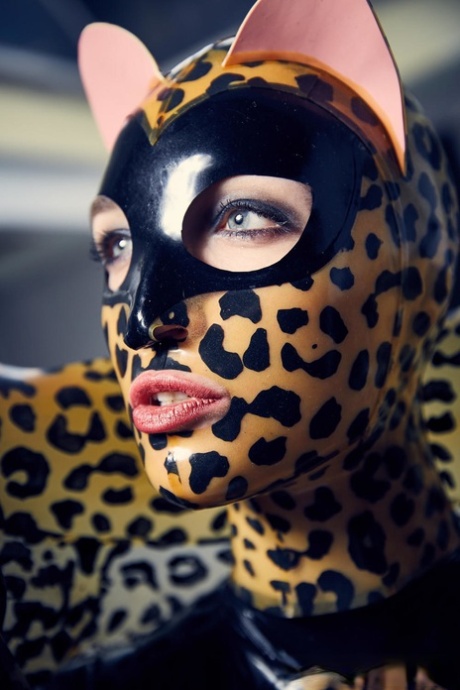 Solo model strikes hot poses in full body leopard print costume 44910893