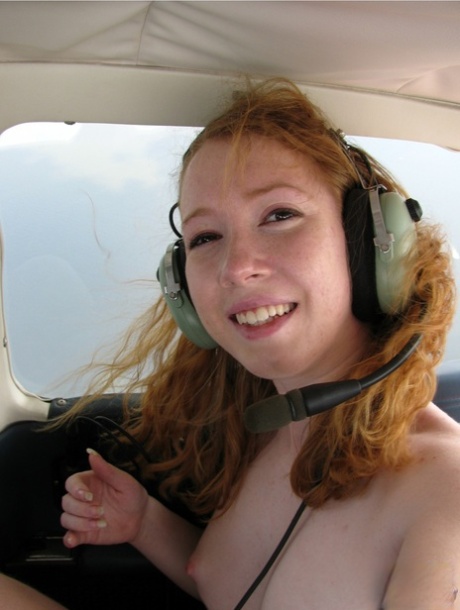 Natural redhead Nicki Blue gets totally naked aboard a small engine aircraft 31602466