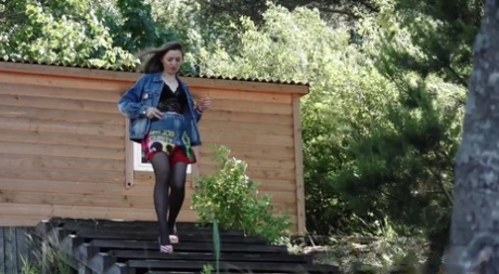 Larisa takes a pee over a dock in a denim jacket and high-heeled shoes 47036786